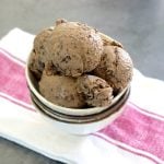 A few scoops of Espresso Gelato with Kahlua in a cream-colored bowl with two bowls below it.