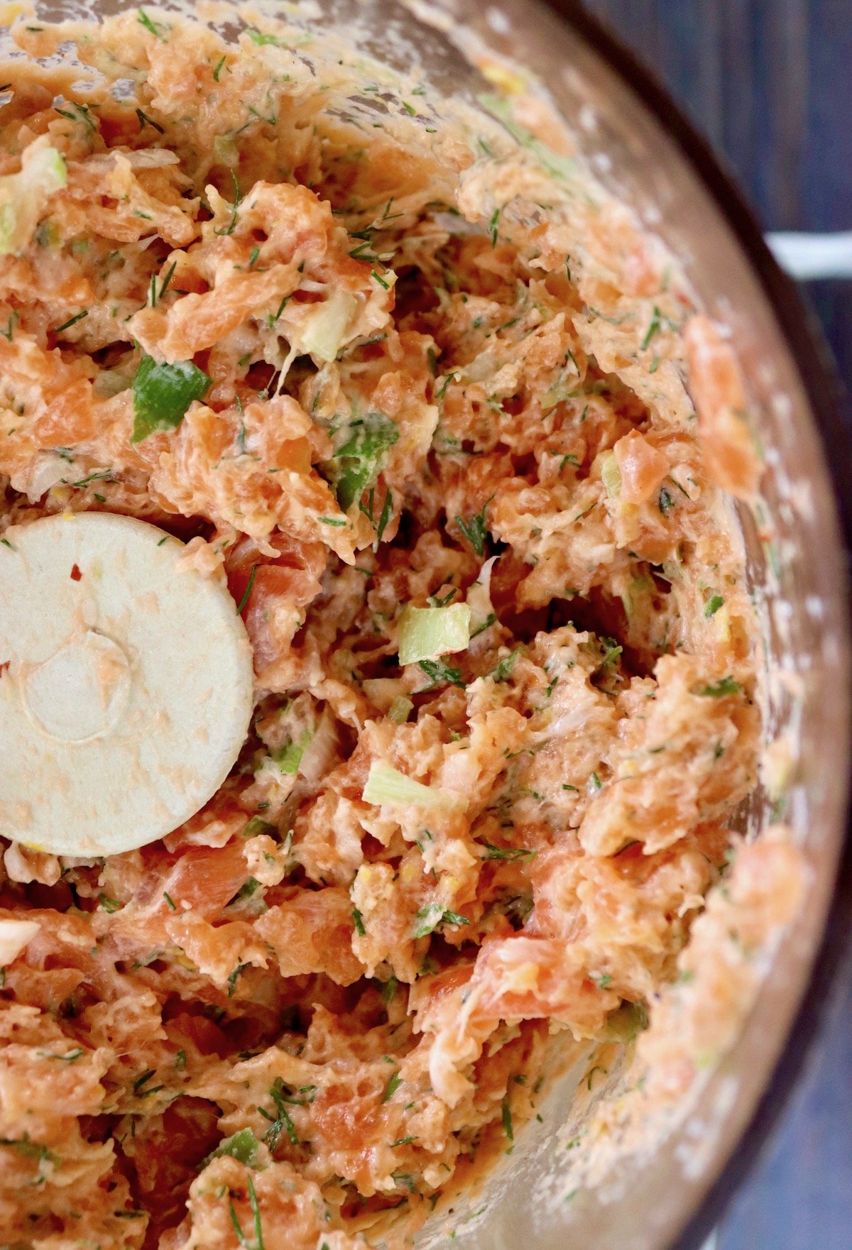 Raw salmon mixture with green onion if food processor.