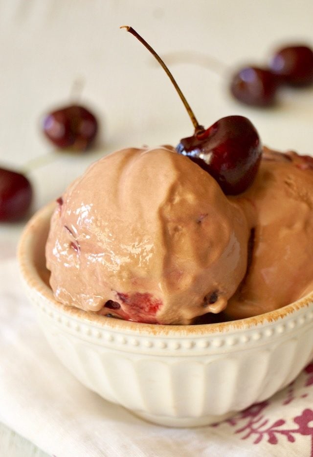 Fat Free Cherry Frozen Yogurt in a cream colored bowl with a cherry on top