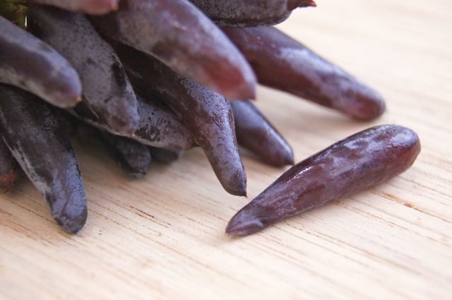 Witch Fingers Grapes bundle with one laying next to it.