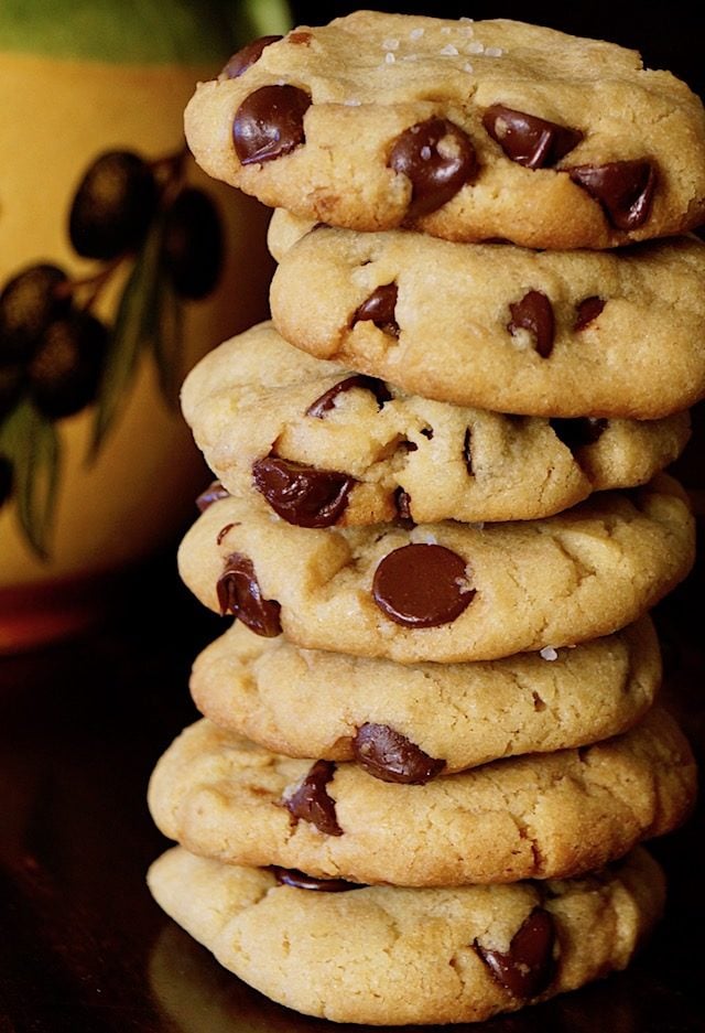 close up of tall stack of olive oil chocolate chip cookies