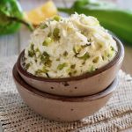 small brown bowl with hatch chile pepper butter