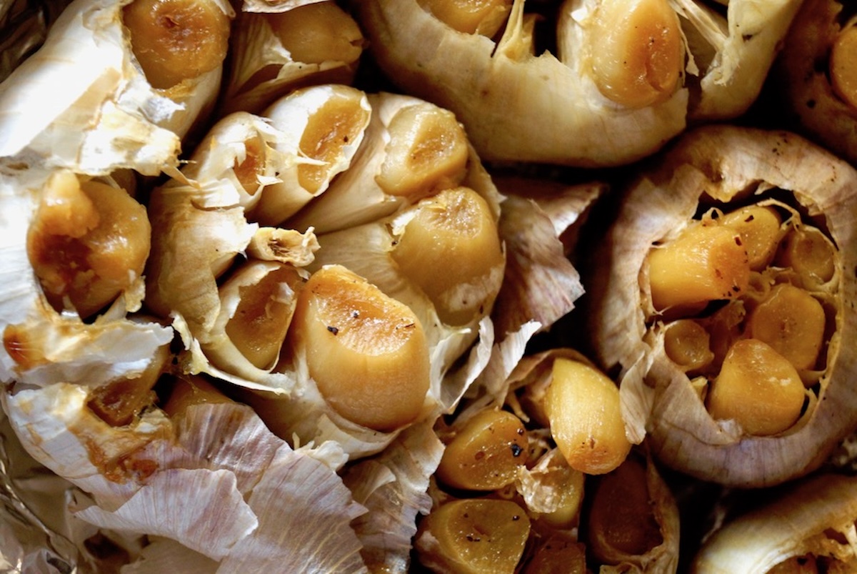 Several roasted heads of garlic.