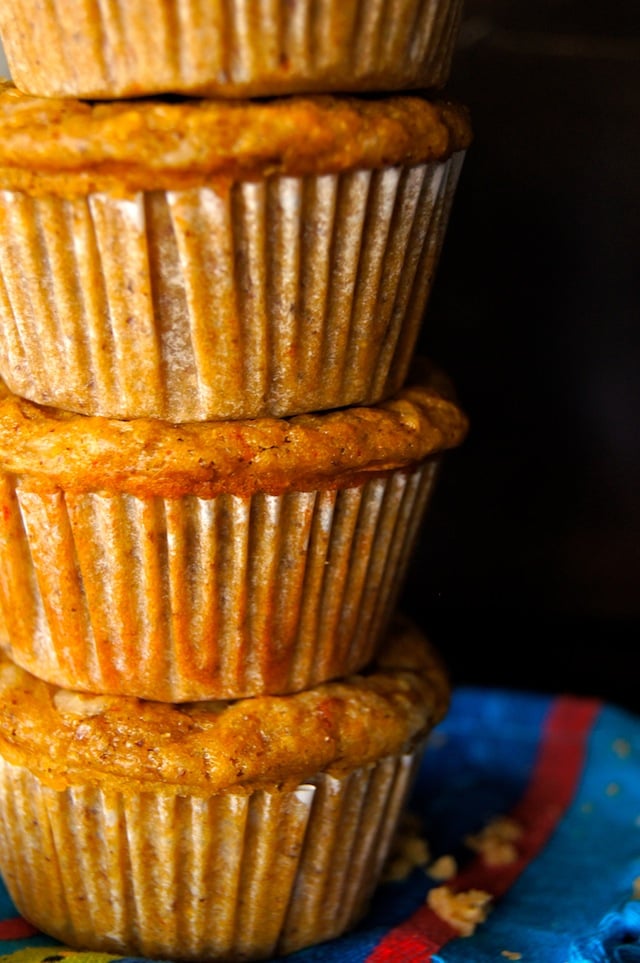 4 Mesquite Chipotle Cheddar Cheese Muffins stacked on top of each other.