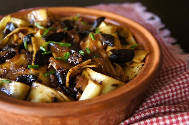 Black Garlic Pappardelle Pasta in a round terracotta dish