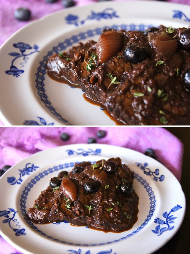 Blueberry Balsamic Braised Brisket on a white plate with blue flowers, on a purple cloth.