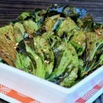 cripsy bok choy chips in square white dish