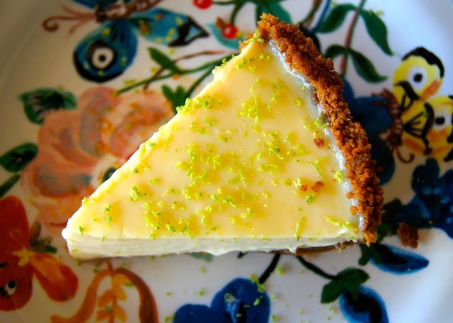 One slice of Citrus Ginger Pie on floral plate