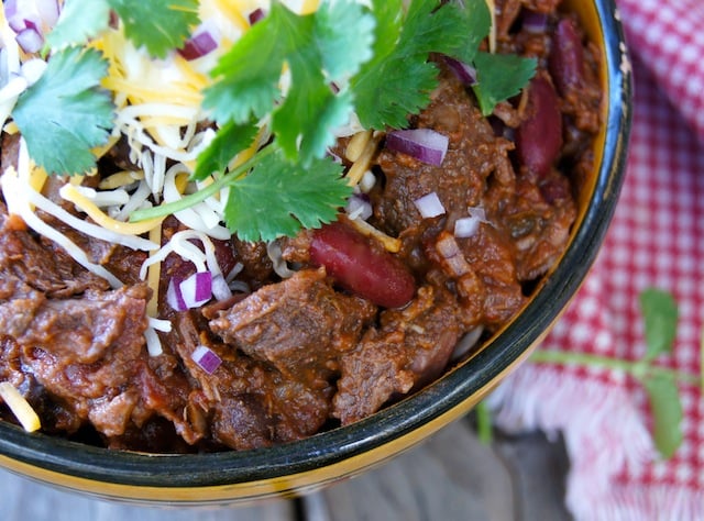 Colorado chili in a bowl with fresh cilantro leaves