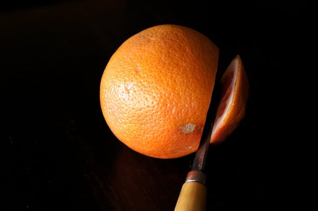 grapefruit with top being sliced off