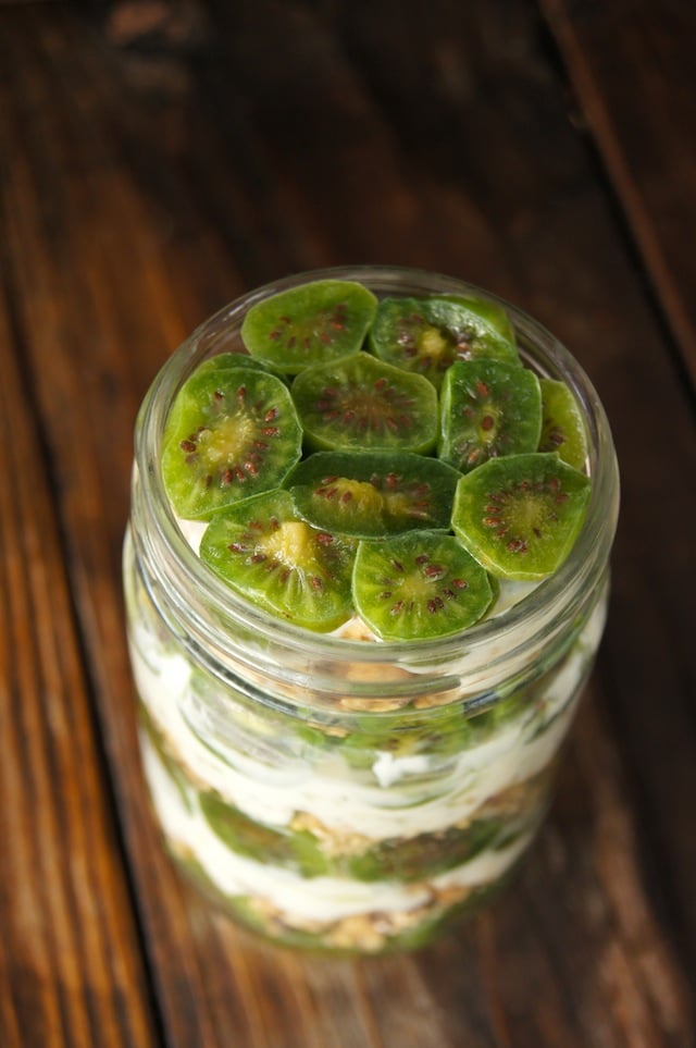 Baby Kiwi Parfait Recipe in a Mason jar on wood surface