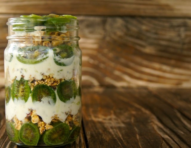 Baby Kiwi Parfait Recipe in a tall Mason jar.