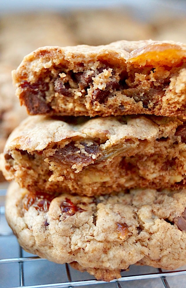 stack of 3 oatmeal raisin chocolate chip cookies broken in half