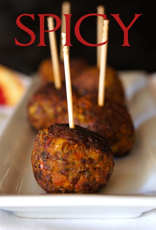 Spicy Quinoa Pesto Bites with toothpicks on white plate