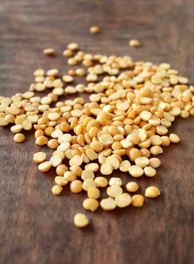 dry yellow split peas on cutting board