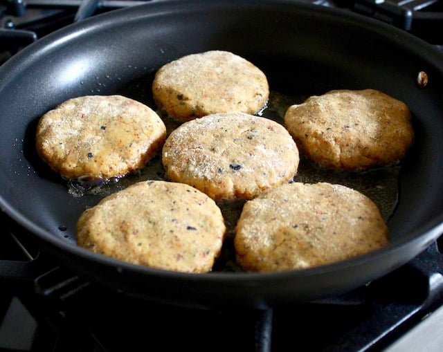 raw split pea burgers in skillet