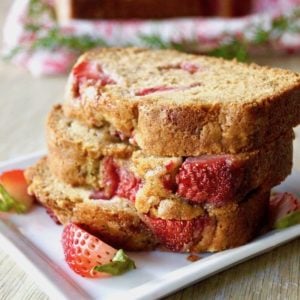 3 stacked slices of Rosemary-Strawberry Cake.