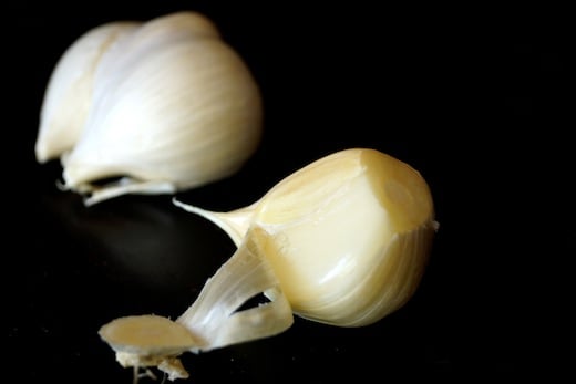 One clove of peeled Elephant Garlic.