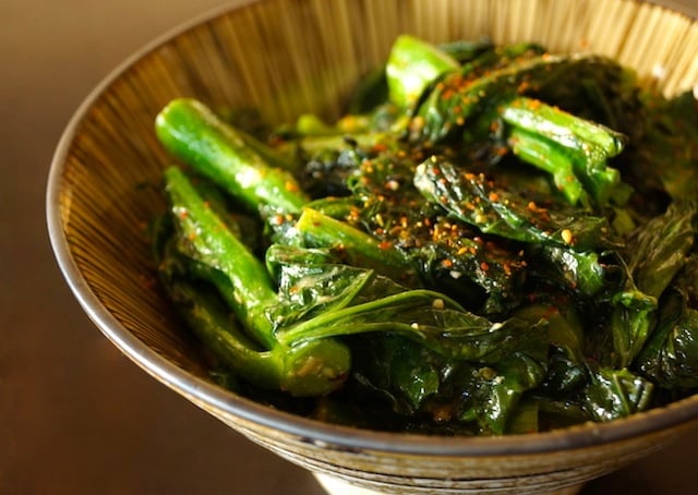 A bowl full of super the bright green Garlicky Coconut Gai Lan recipe.