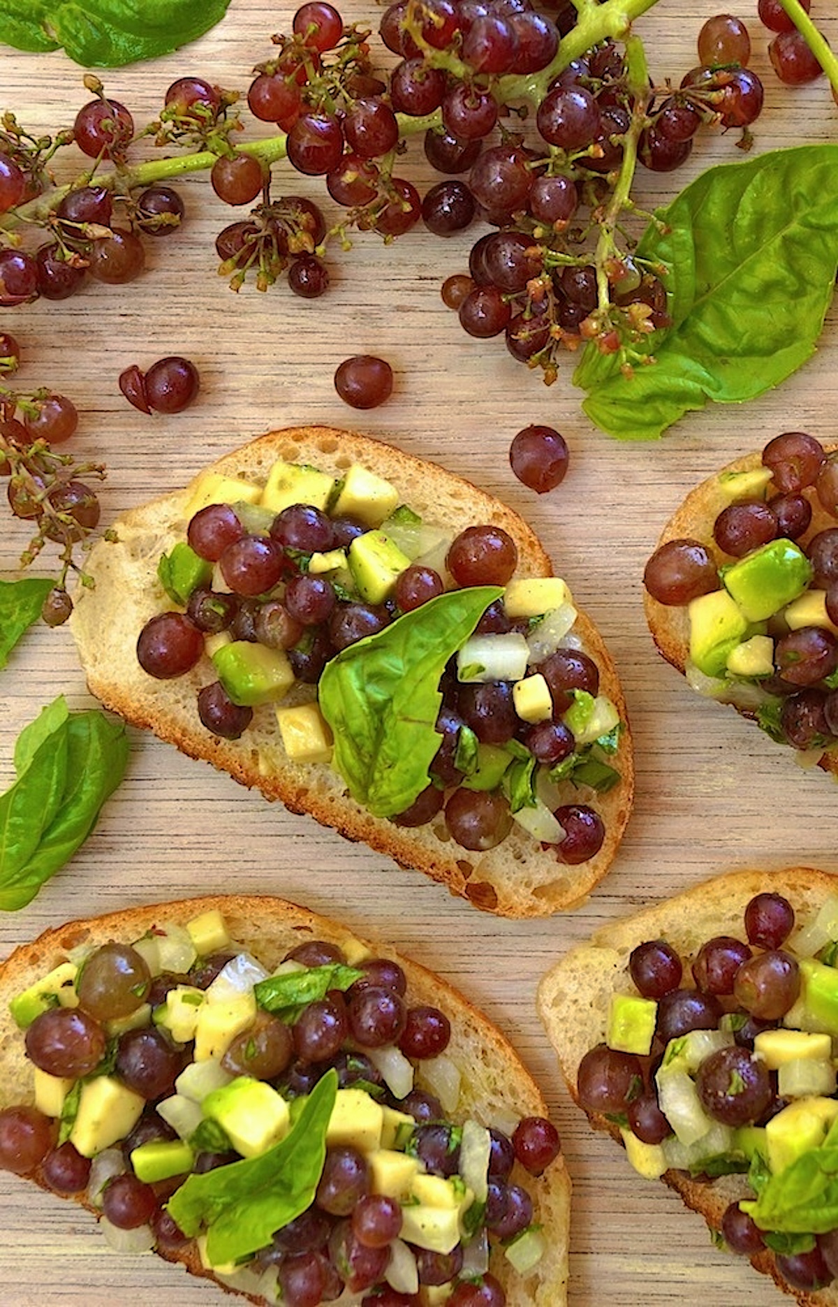 A few slices of a baguette with champagne bruschetta on top.