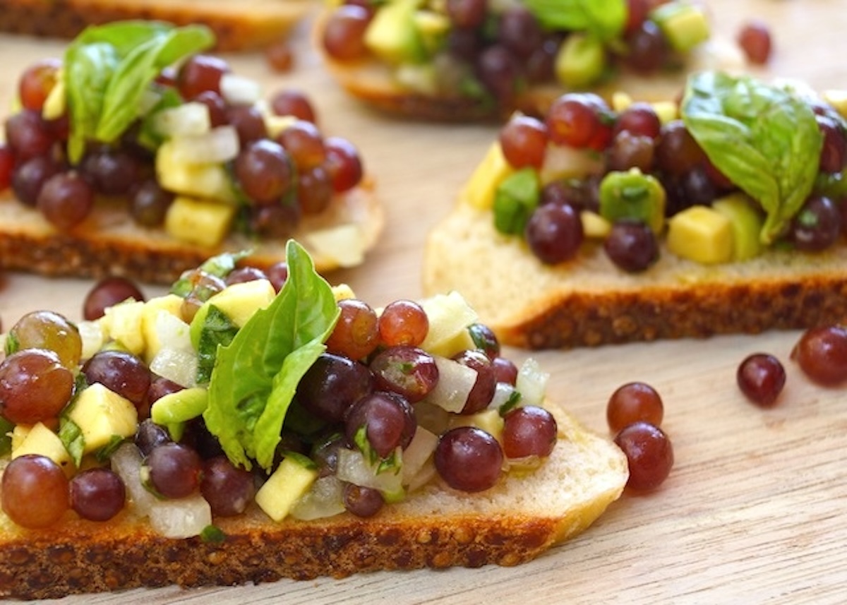 A few slices of a baguette with champagne bruschetta on top.