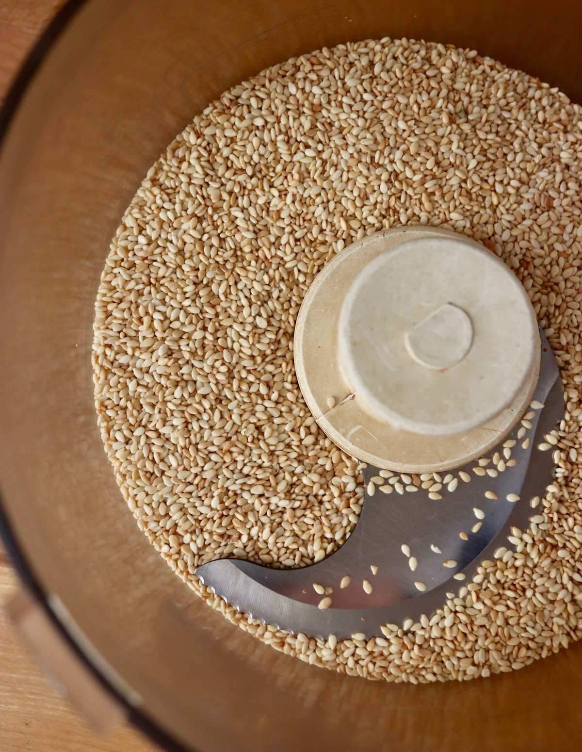 Toasted sesame seeds in food processor. 