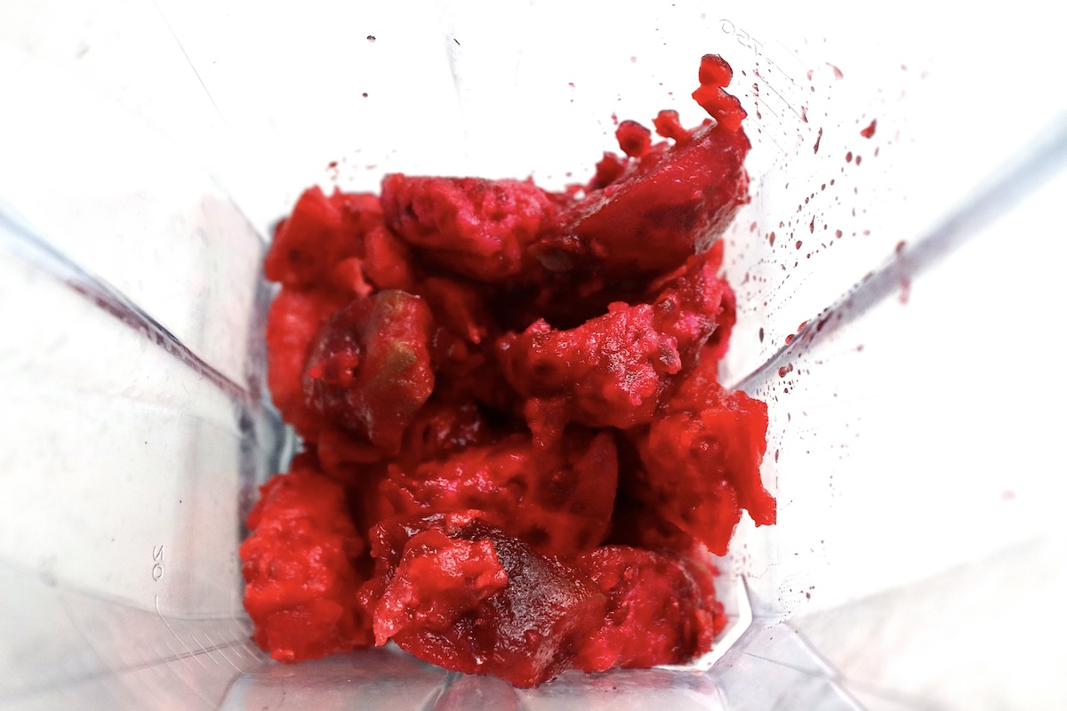 Chunks of prickly pear in the bottom of a blender.