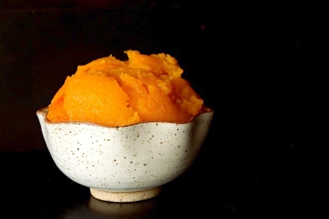 roasted butternut squash in a cream colored ceramic bowl