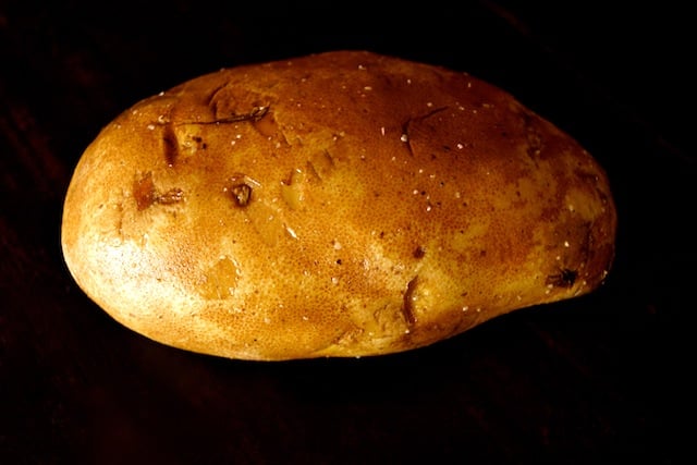One whole oiled Russet potato 
