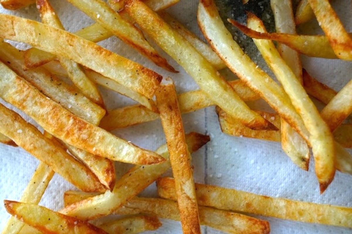 Roasted French fries on paper towels.