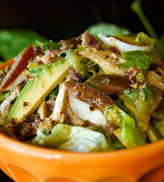 Close up of Shedded Chicken Cobb Salad in orange bowl