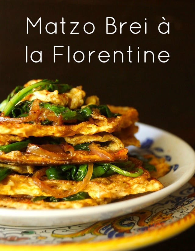 Matzo Brei a la Florentine, stacked on a white plate, with black background.