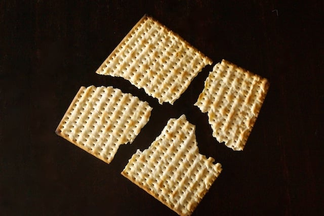 One matzo cracker broken into 4 pieces for Matzo Brei à la Florentine