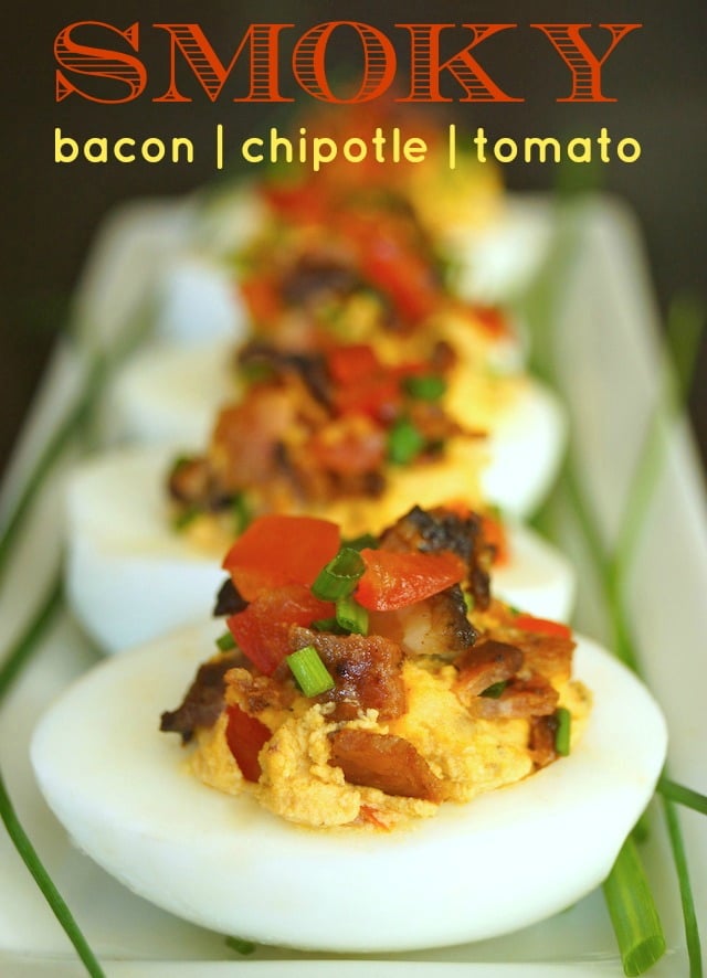 Bacon Chipotle Deviled Eggs on a narrow white platter