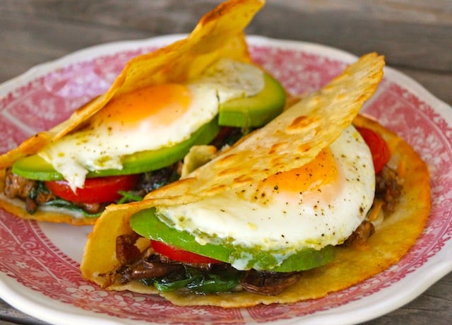 Two Breakfast Tacos on a red and white plate