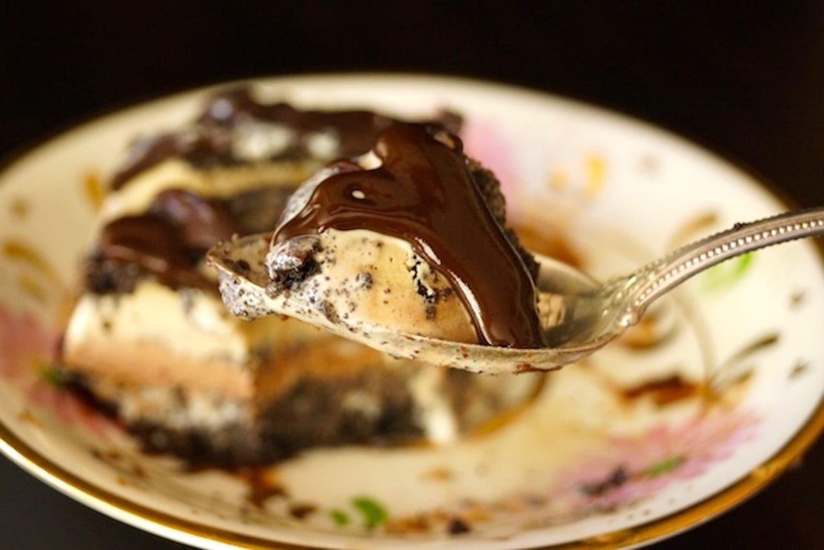Single serving of an ice cream mud pie with espresso chocolate sauce.