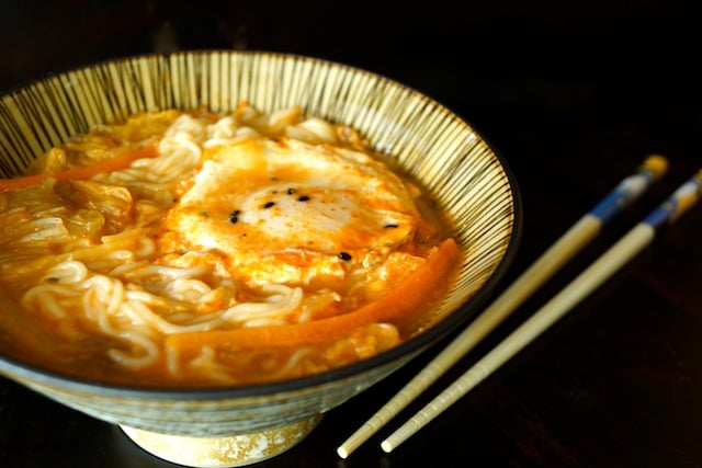 Kimchi Rame with egg in a bowl with chopsticks