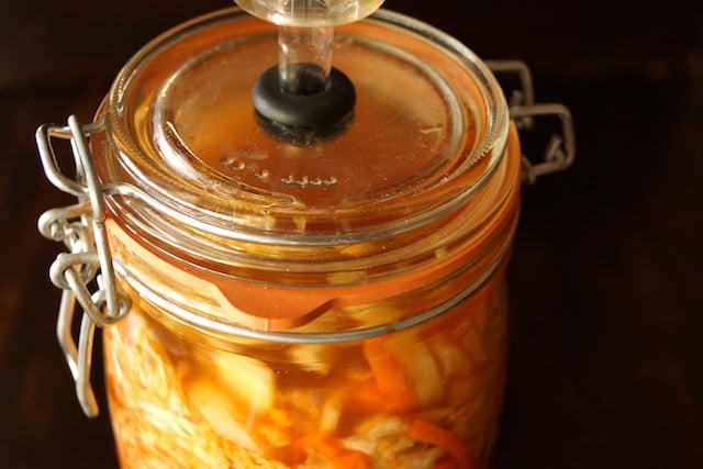 Top view of kimchi fermenting in a jar