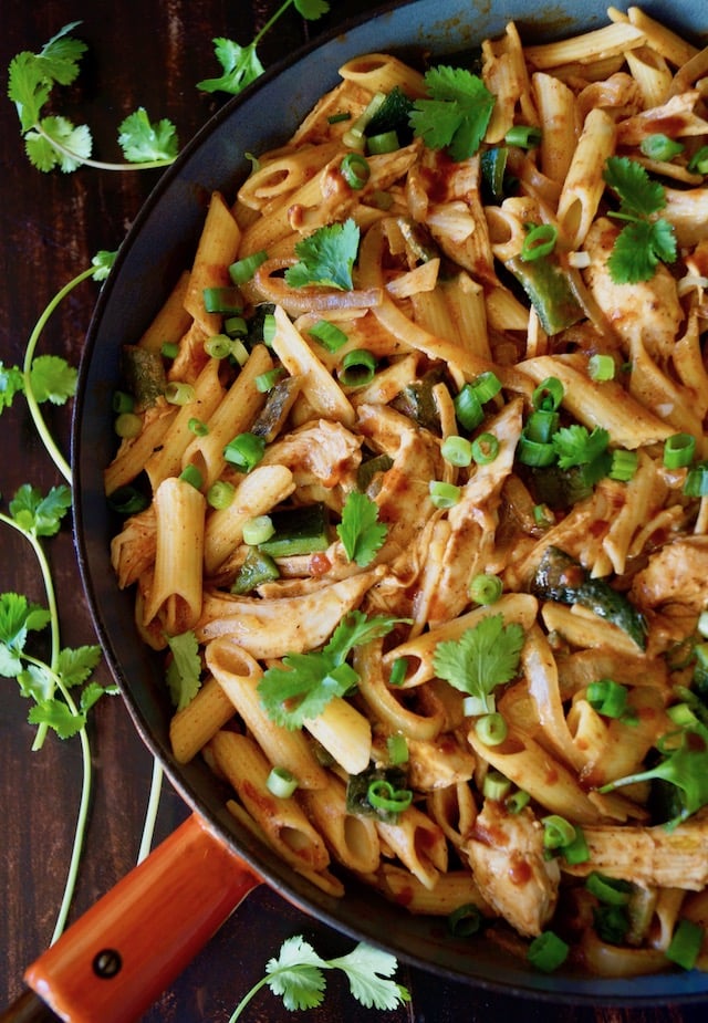 Mexican Chicken Poblano Pasta in a skillet with an orange handle