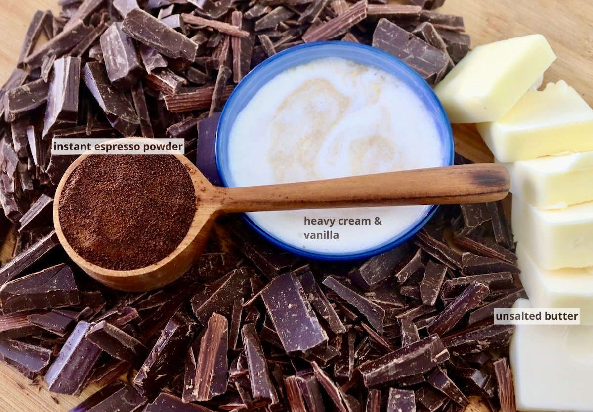 Ingredients for espresso chocolate sauce including butter, cream and vanilla, espresso powder, and chopped chocolate.