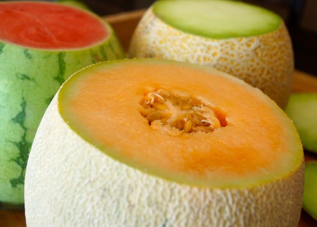 Close up of an orange melon with top cut off 