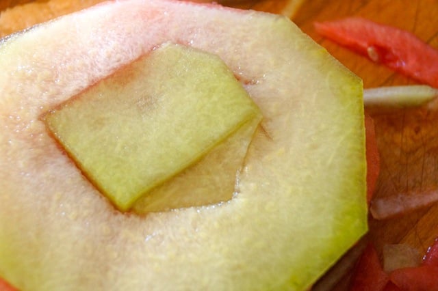 Fresh melon slices on cutting board