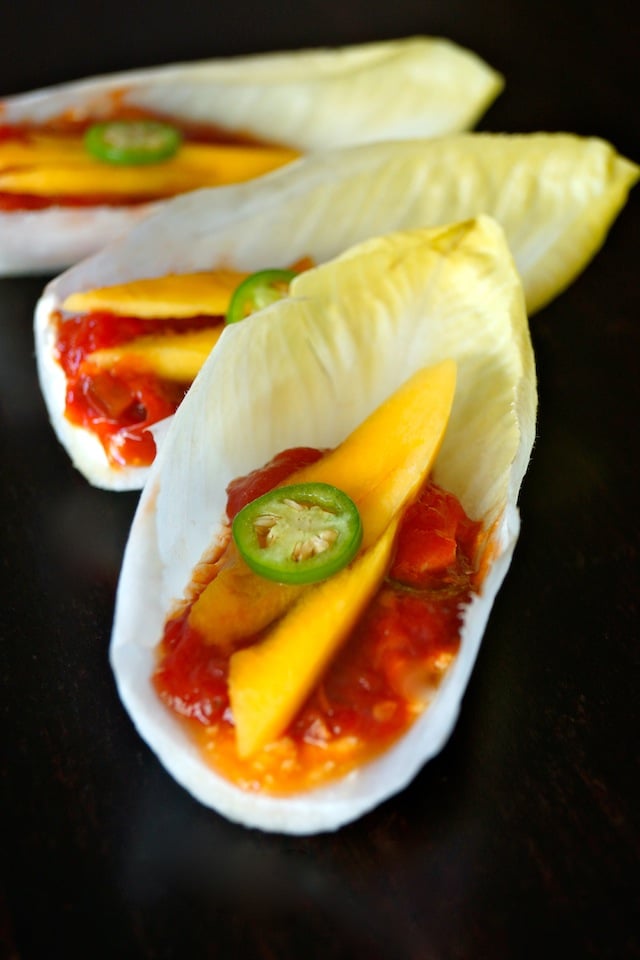 Close up of Mango Appetizer with Spicy Tomato on black background