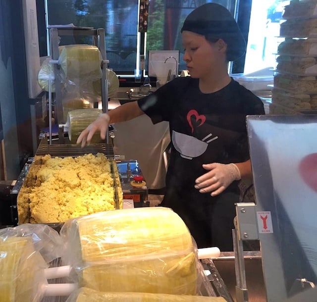 girl working in the noodle room a the Los Angeles Tatsu Ramen Restaurant.