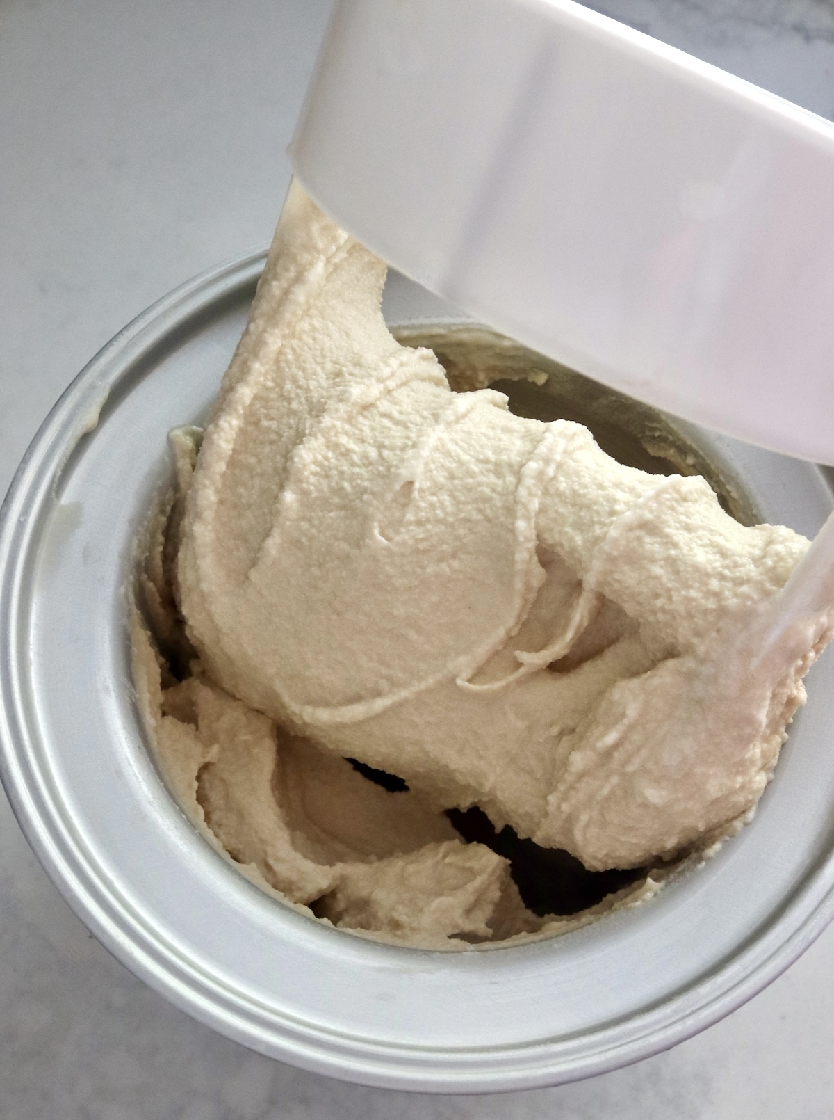 Root beer float ice cream in ice cream maker.