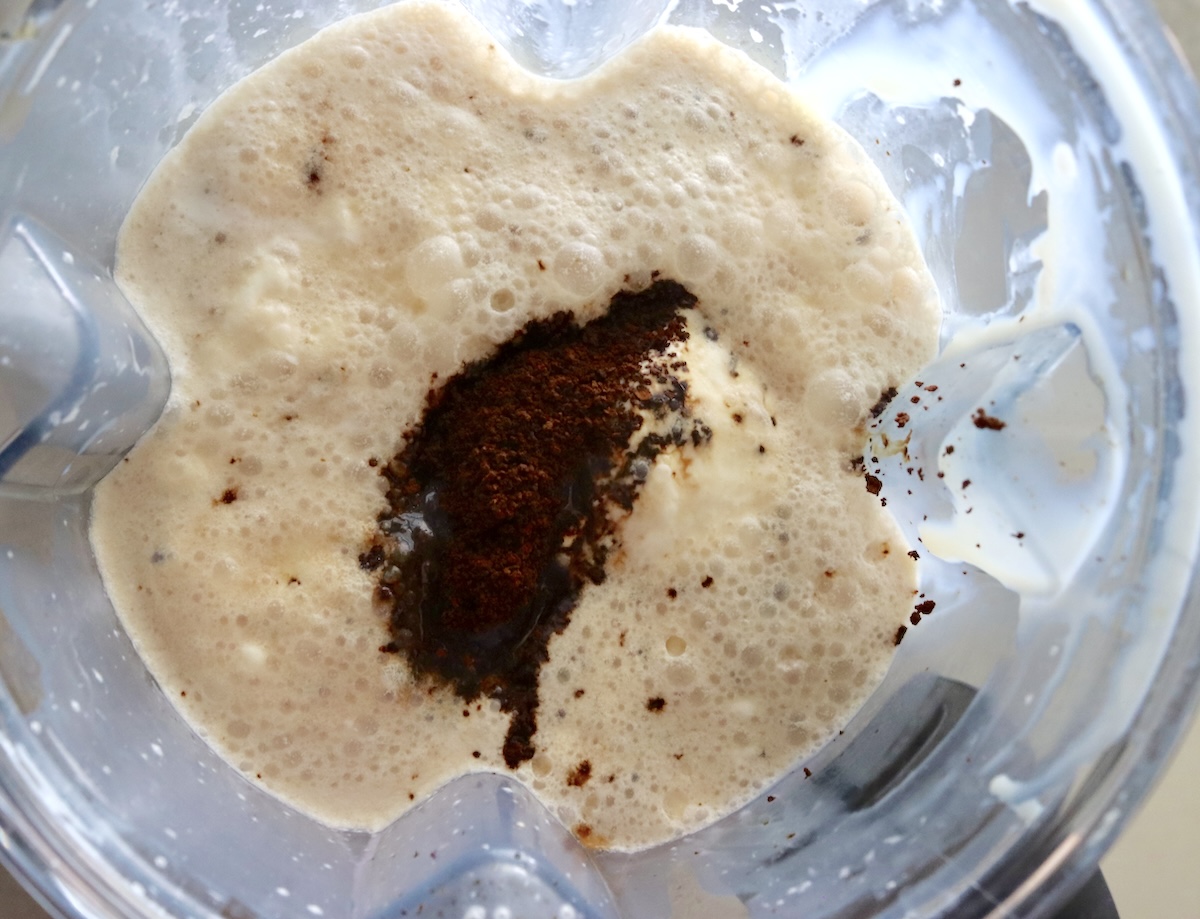 Blender with cream, coffee grounds, vanilla and sweetened condensed milk.
