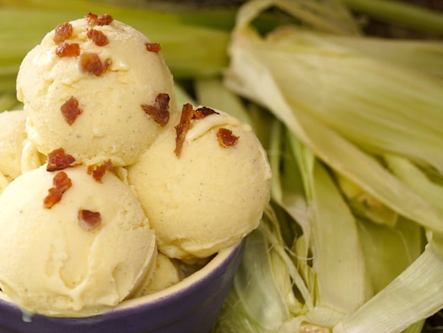 Corn Ice Cream in a purple bowl with bits of bacon on top.