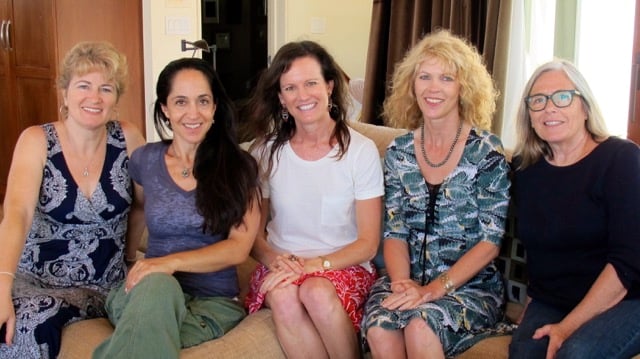 5 ladies sitting on sofa