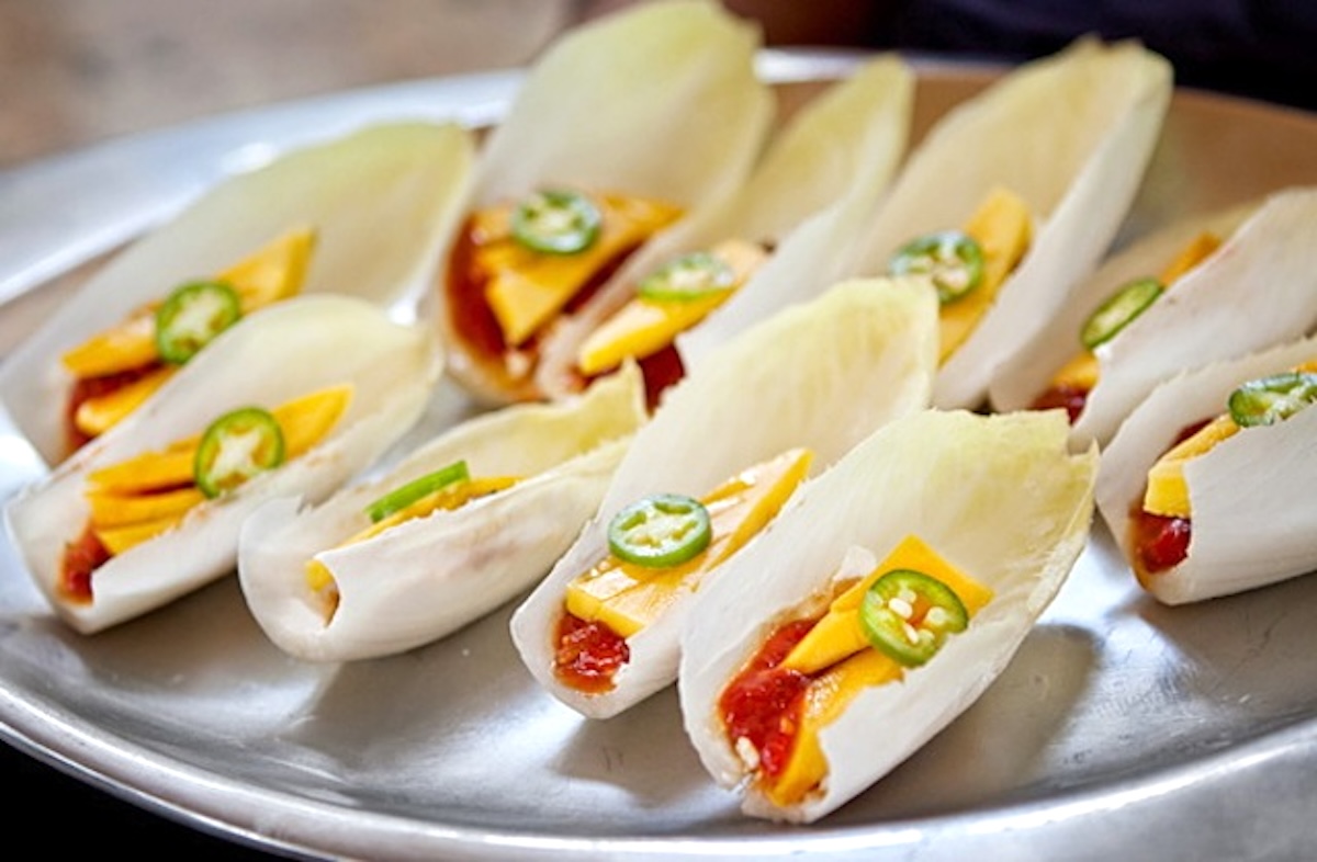 Several sweet and Spicy Tomato-Mango Appetizers on a silver tray.
