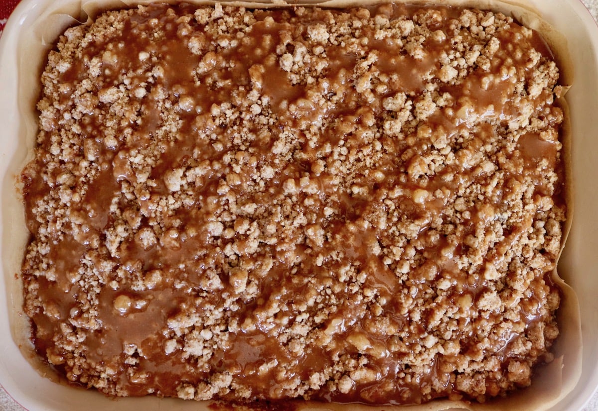 Streusel-topped, caramel-drizzled coffee cake in the pan.